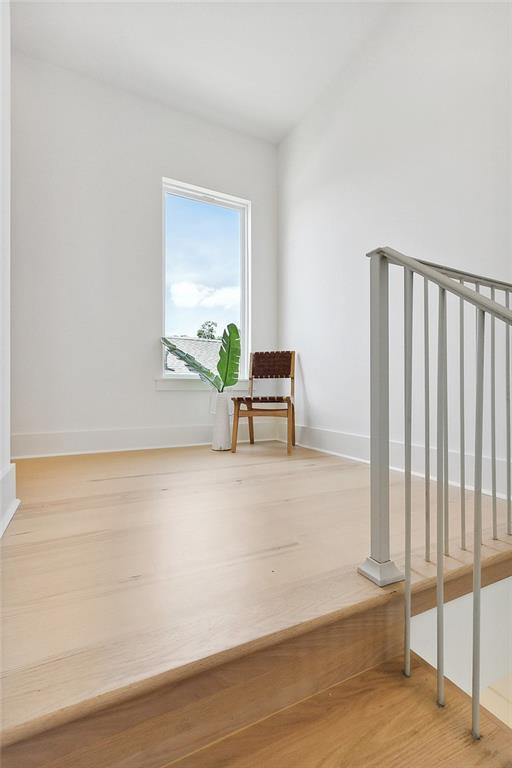 unfurnished room featuring wood-type flooring