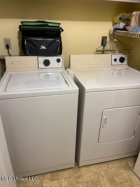 washroom with washer and dryer