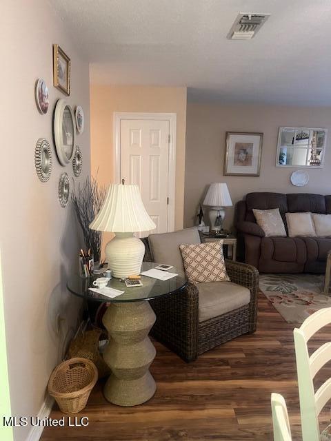 living room with dark hardwood / wood-style floors