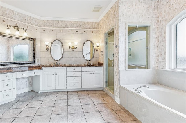 bathroom with a wealth of natural light, a sink, and double vanity