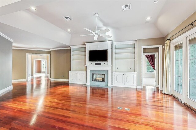 unfurnished living room featuring lofted ceiling, light wood finished floors, and visible vents