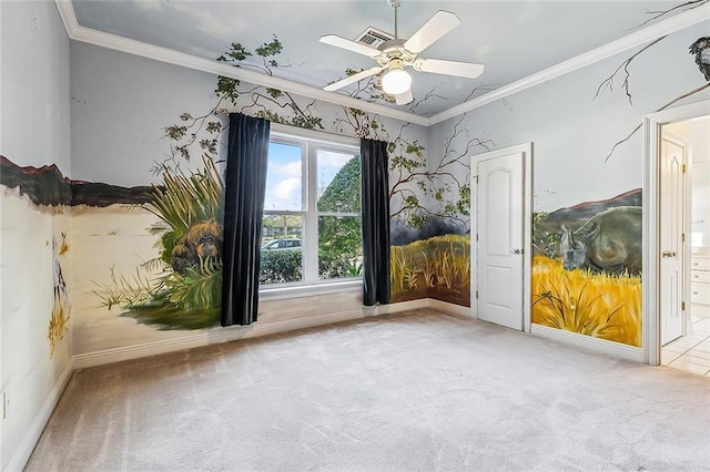 empty room with crown molding, ceiling fan, and light colored carpet