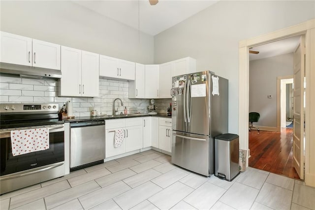 kitchen featuring white cabinetry, sink, and appliances with stainless steel finishes