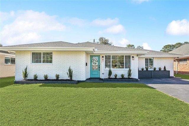 ranch-style house with a front lawn