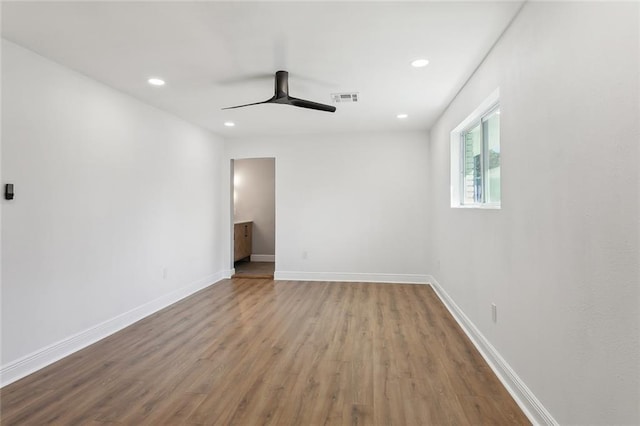 spare room with ceiling fan and hardwood / wood-style floors