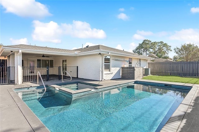 view of pool with an in ground hot tub, ceiling fan, a patio, and central AC unit