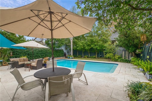 view of pool with a patio area and an outdoor living space