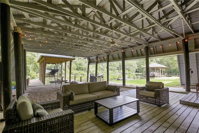 sunroom featuring lofted ceiling and a healthy amount of sunlight