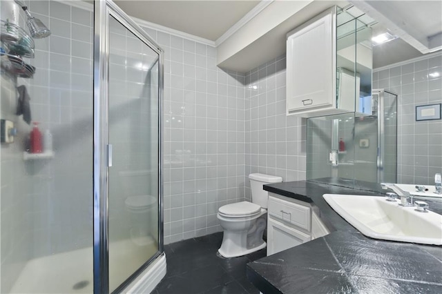 bathroom with toilet, tile walls, walk in shower, crown molding, and vanity