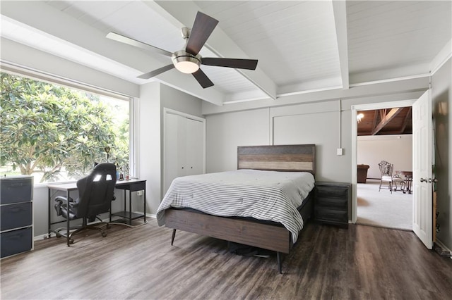 bedroom featuring ceiling fan, beam ceiling, a closet, and dark hardwood / wood-style flooring