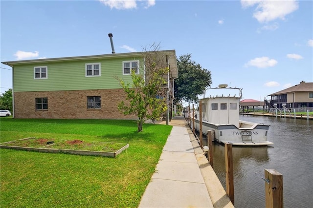 exterior space with a yard and a water view