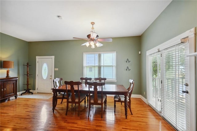 dining room with hardwood / wood-style flooring, ceiling fan, and a healthy amount of sunlight