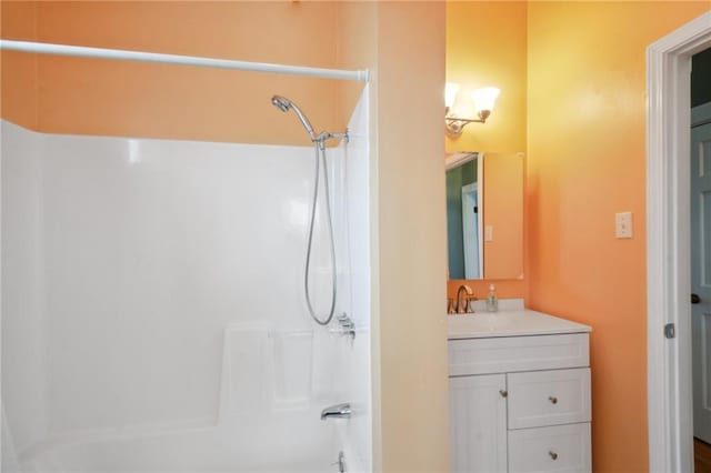 bathroom featuring vanity and shower / bathtub combination