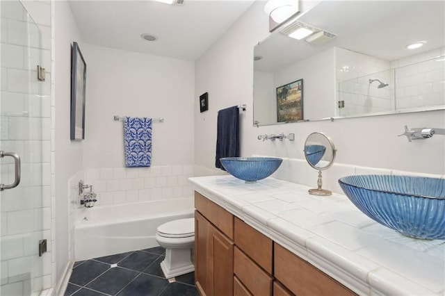 full bathroom featuring tile patterned flooring, vanity, toilet, and independent shower and bath