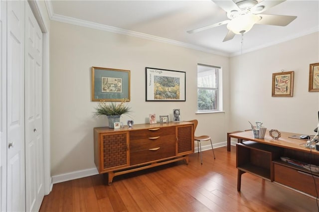 office featuring wood-type flooring, ceiling fan, and ornamental molding