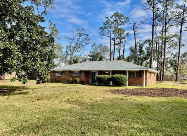 ranch-style house with a front lawn