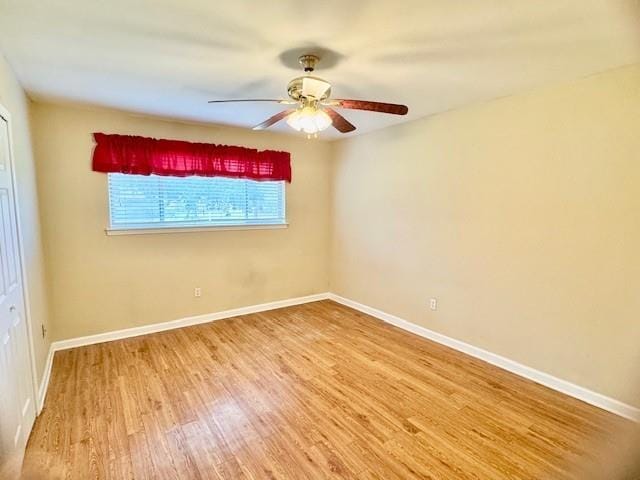 spare room featuring ceiling fan and wood-type flooring