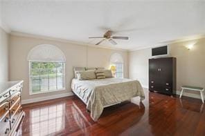 bedroom featuring crown molding, ceiling fan, and dark hardwood / wood-style floors