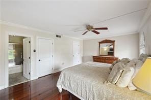 bedroom featuring crown molding, dark wood-type flooring, ceiling fan, and ensuite bathroom