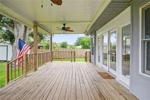 wooden deck featuring french doors and ceiling fan