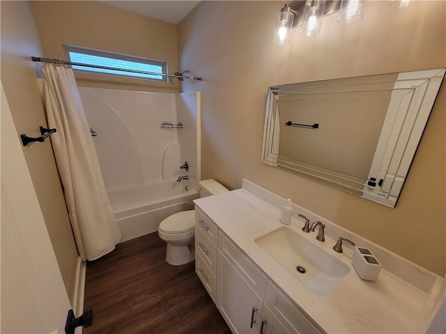 full bathroom with vanity, hardwood / wood-style floors, shower / bath combination with curtain, and toilet