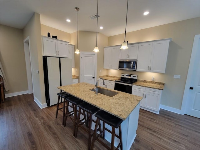 kitchen with white cabinetry, a kitchen island with sink, and appliances with stainless steel finishes