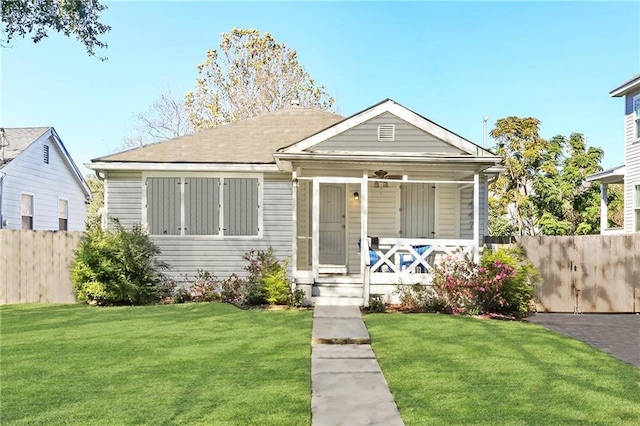 bungalow-style home with a porch and a front yard