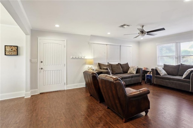 living room with ceiling fan, ornamental molding, and dark hardwood / wood-style floors