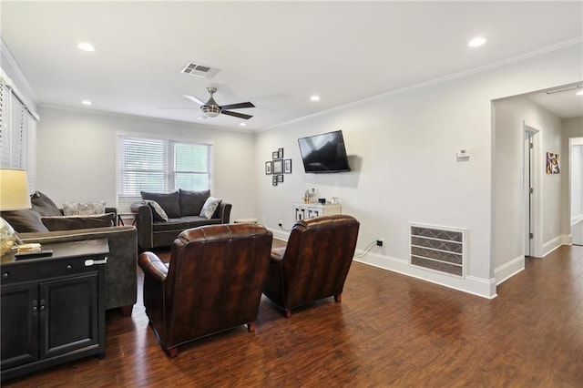 living room featuring ceiling fan, crown molding, and dark wood-type flooring