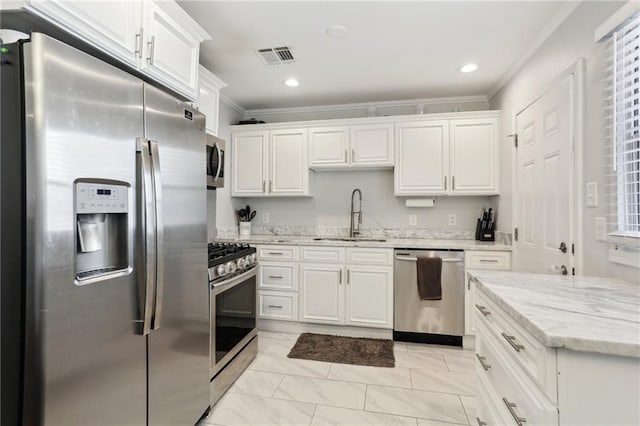 kitchen featuring sink, stainless steel appliances, and white cabinets