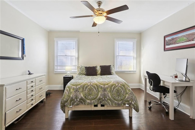 bedroom featuring ceiling fan, dark wood-type flooring, and multiple windows