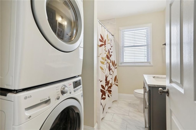 washroom with stacked washer and dryer