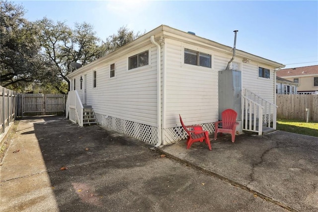 rear view of property featuring a patio