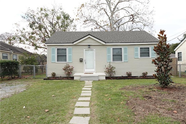 bungalow-style house with a front yard