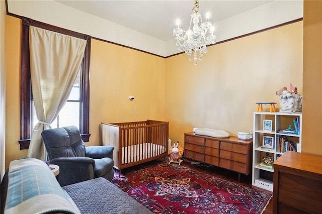 bedroom featuring an inviting chandelier