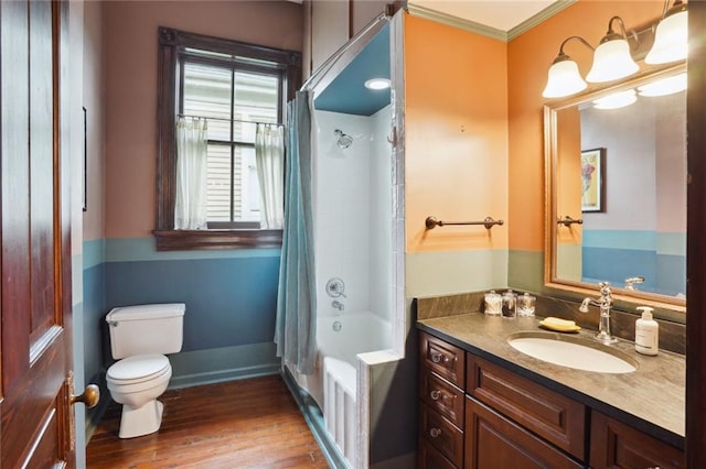 full bathroom featuring shower / tub combo with curtain, hardwood / wood-style flooring, toilet, vanity, and crown molding