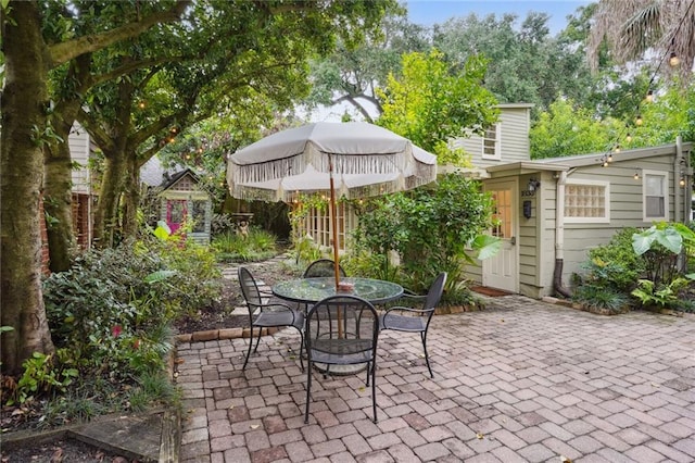 view of patio featuring a storage shed