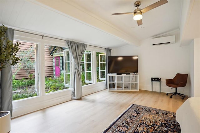 living room featuring ceiling fan, lofted ceiling with beams, hardwood / wood-style flooring, and a wall mounted AC