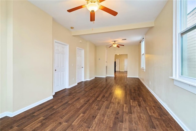 unfurnished room featuring beam ceiling, ceiling fan, and dark hardwood / wood-style floors