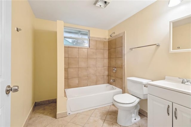 full bathroom with toilet, tiled shower / bath, tile patterned floors, and vanity