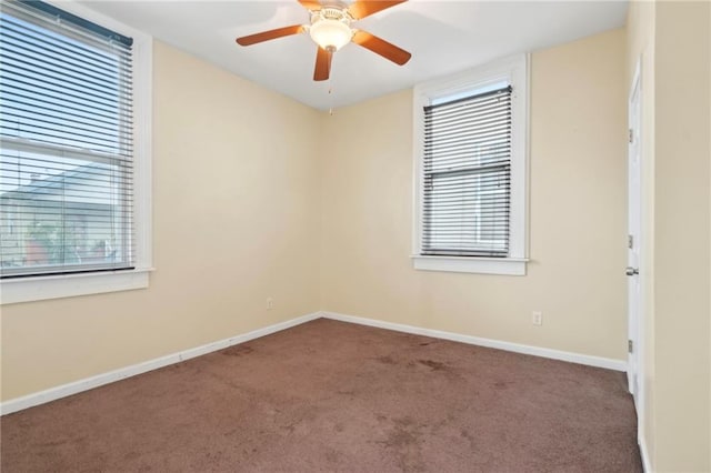 empty room featuring carpet floors and ceiling fan