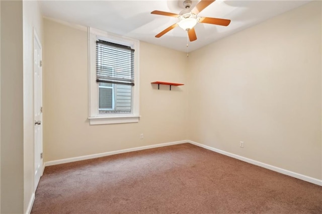 empty room with carpet flooring and ceiling fan