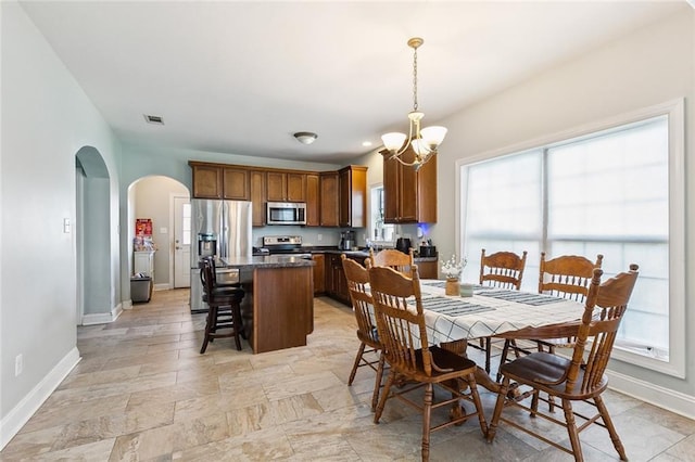 dining area featuring a chandelier