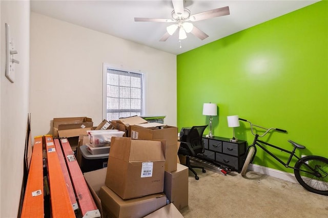 interior space with ceiling fan