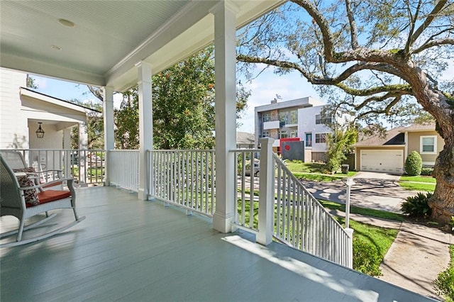 view of patio featuring a porch and a residential view