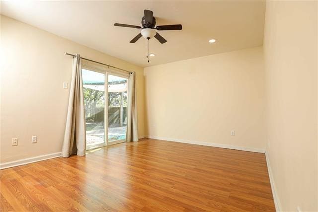 empty room featuring light hardwood / wood-style floors and ceiling fan