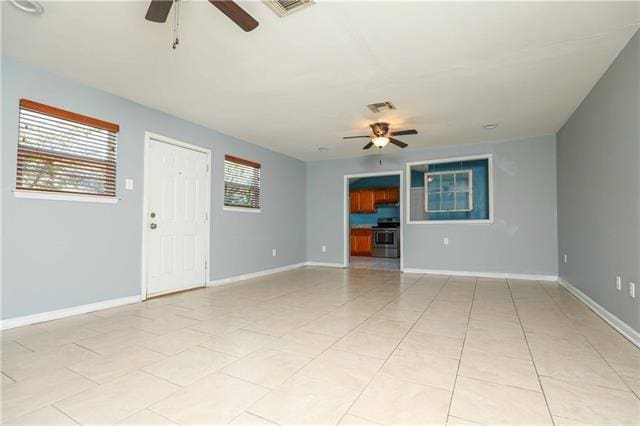 unfurnished living room with light tile patterned flooring