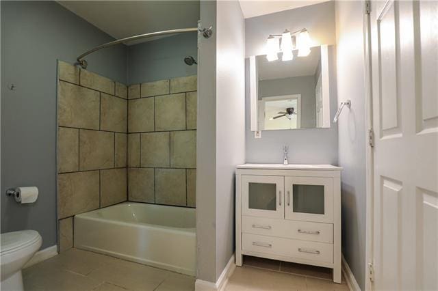 full bathroom with tile patterned floors, vanity,  shower combination, and toilet