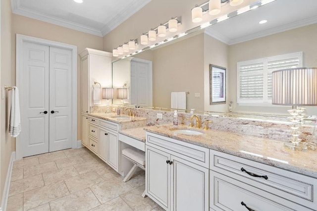 bathroom featuring vanity and ornamental molding