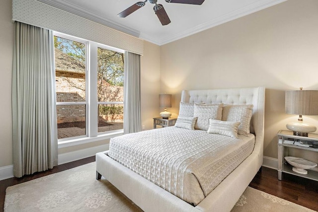 bedroom featuring wood-type flooring, ceiling fan, and ornamental molding